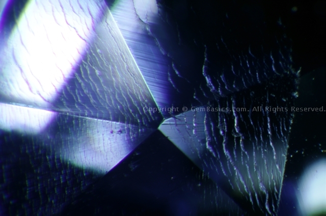 Surface cracks in Verneuil synthetic sapphire